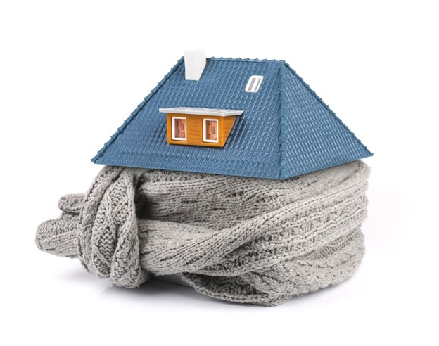 A miniature house bundled up in a scarf