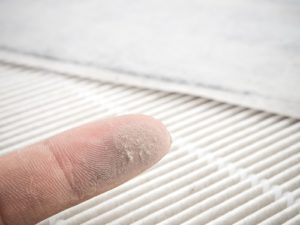 A finger with dust on it