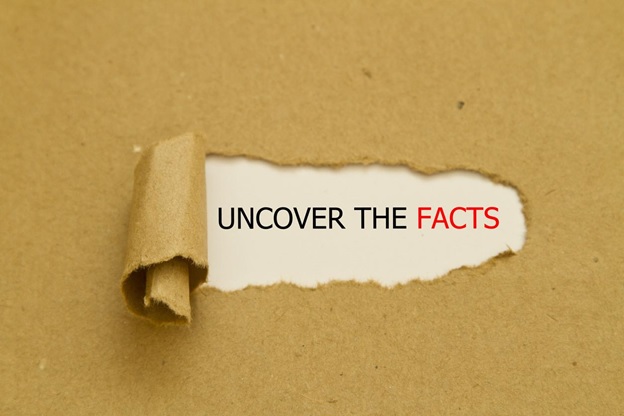 A piece of paper tearing away to reveal "uncover the facts"