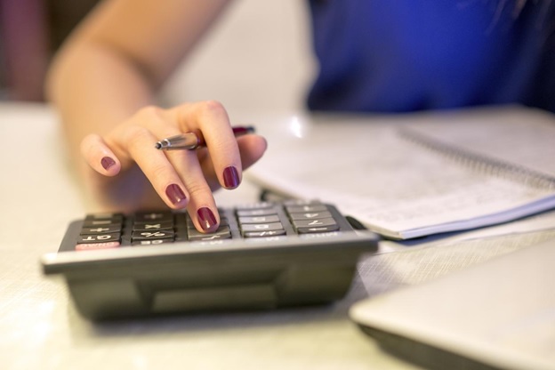 A woman using a calculator