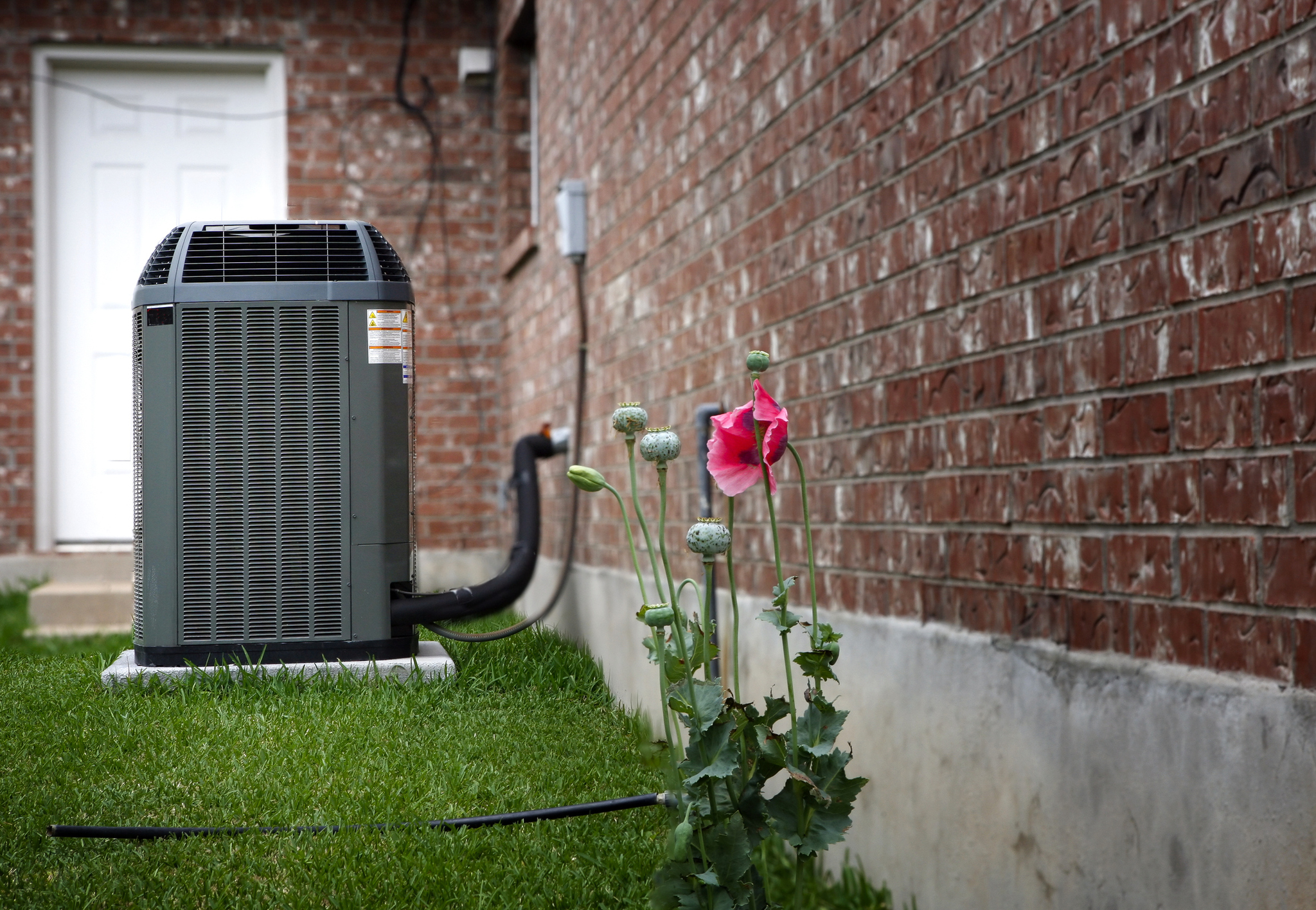 new air conditioning unit installed outside an Illinois home