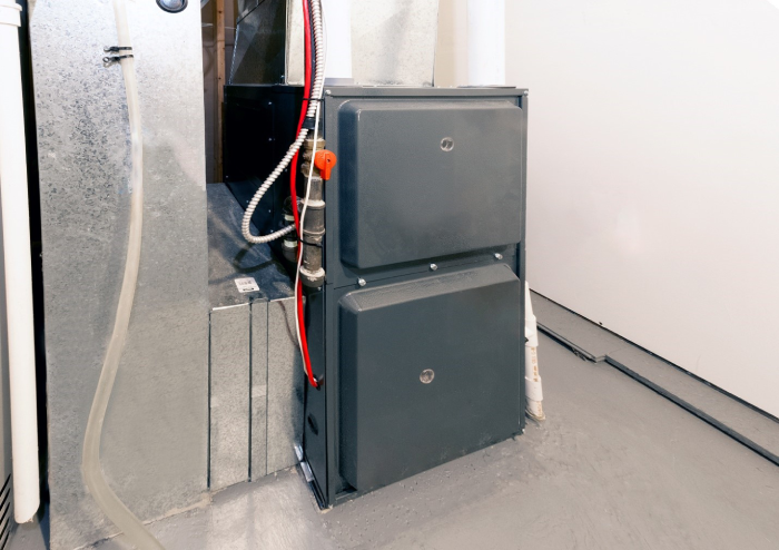 an electric furnace in the basement of a home