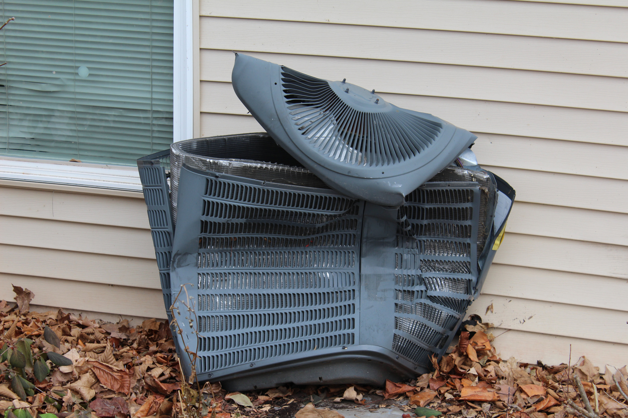 damaged air conditioner that needs to be replaced
