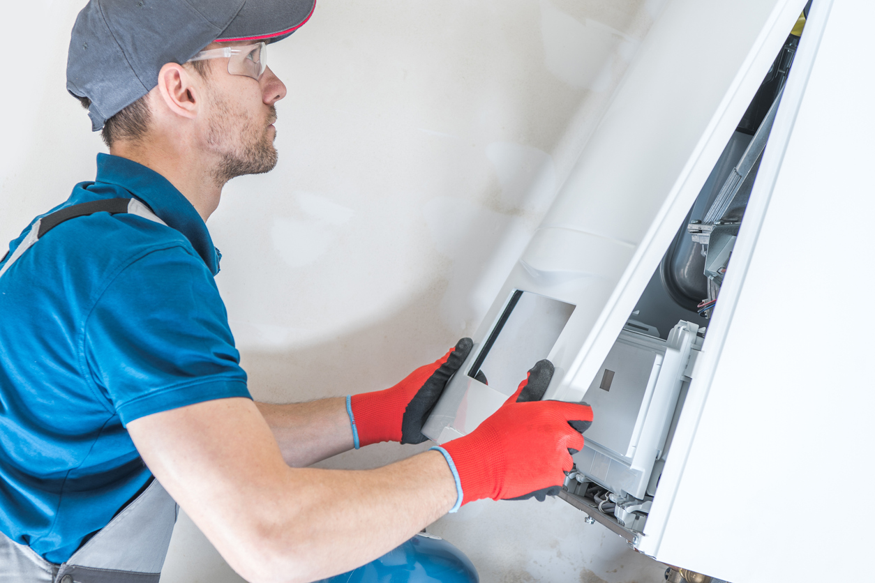 Illinois HVAC technician installing a furnace